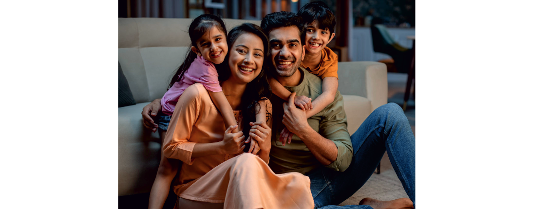 A family at their new home, built by Shree Aryan Builders and Developers